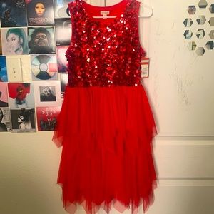 Red pretty sparkly dress with a poof at the bottom 😍